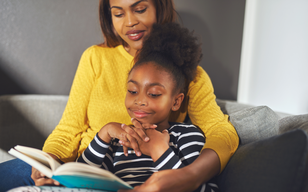 Parent reading social emotional book with their child. 