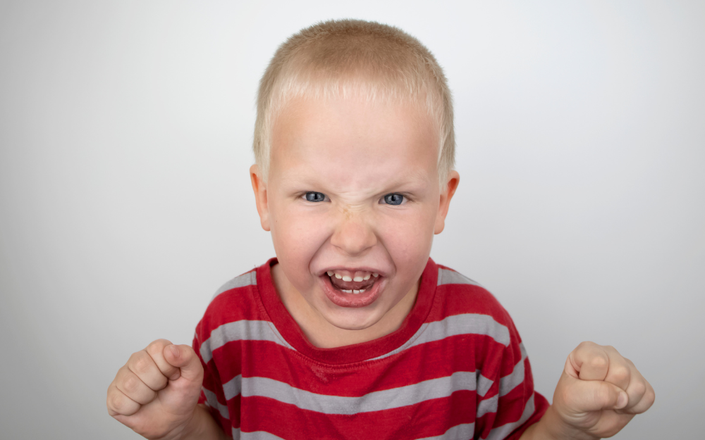 Child showing angry face. 