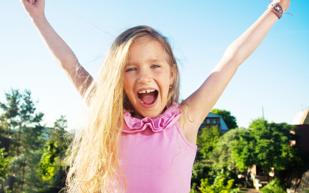 Child showing happy face. 