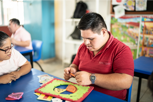 Teenage boy working in his classroom. 