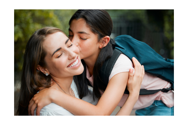 Child giving mother brief kiss at the start of school. 